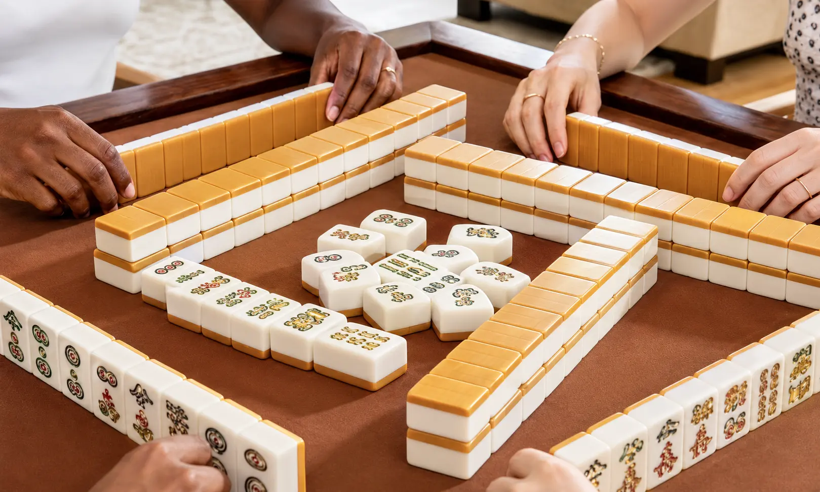 People playing Mahjong together with a premium Mahjong set