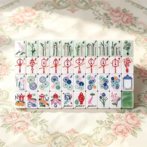 Celadon green acrylic mahjong tile set featuring layered design, jade-inspired texture, and elegant green and pink colour details