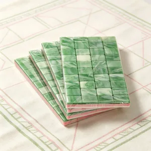 Celadon green acrylic mahjong tile set featuring layered design, jade-inspired texture, and elegant green and pink colours