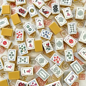 Ginger Yellow Mahjong Tiles on Traditional Patterned Cloth
