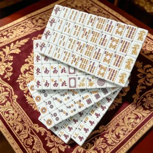 Black and white mother-of-pearl acrylic mahjong tile set displayed in an elegant game setting with premium pearl finish
