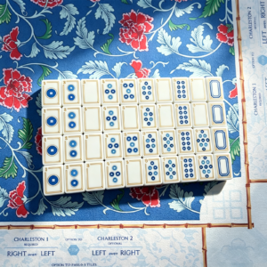 Sapphire Trail acrylic Mahjong tiles arranged on a blue floral game mat