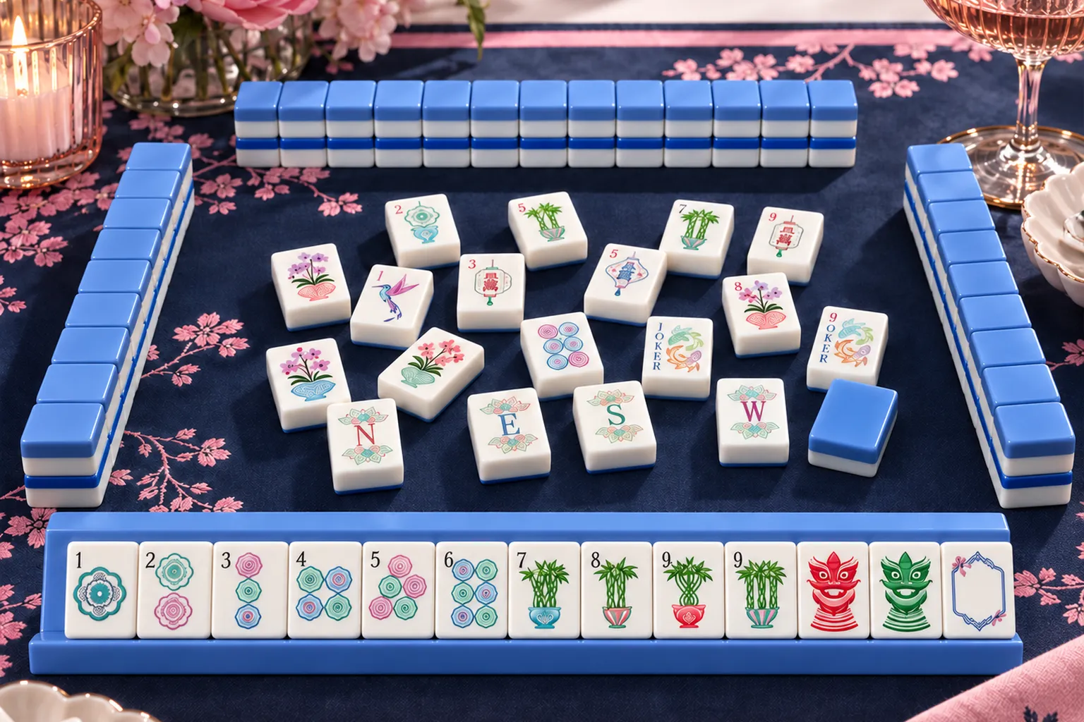 American Mahjong tiles arranged on a navy mat with racks and colourful tile designs